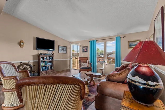 a bedroom with a bed and a television