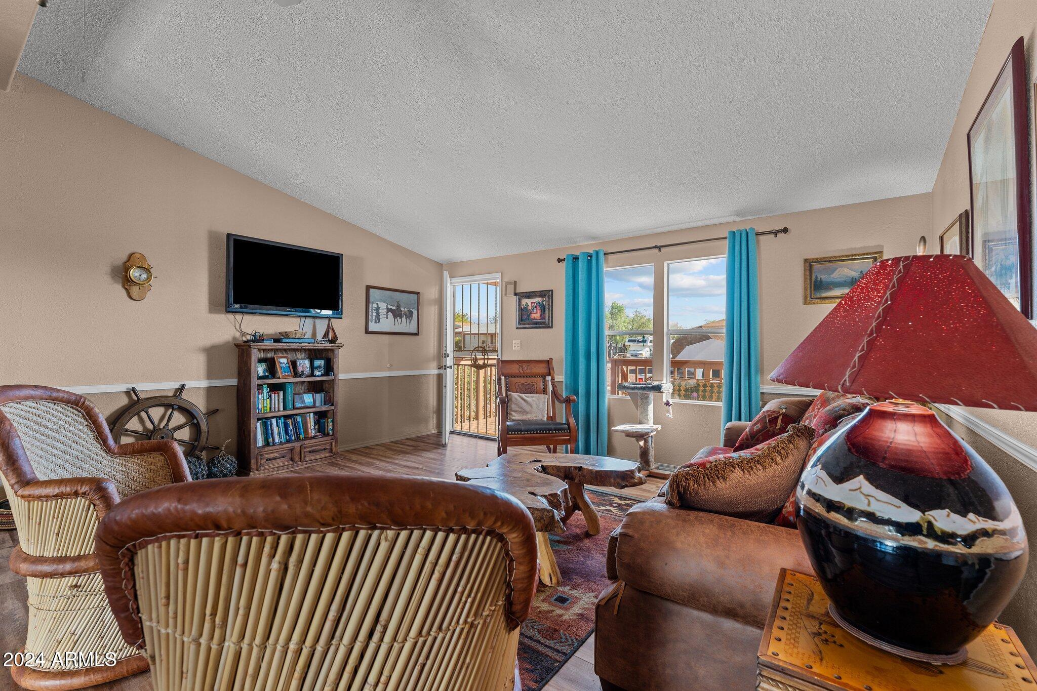 30854 Wandering Way Congress, AZ 85332 - Photo 9 of 43 a bedroom with a bed and a television