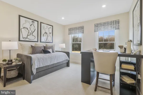 a bedroom with a bed and a couch