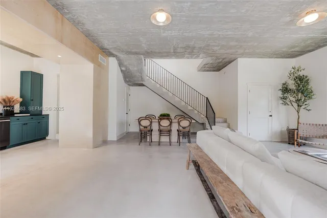 a dining room with furniture and entryway