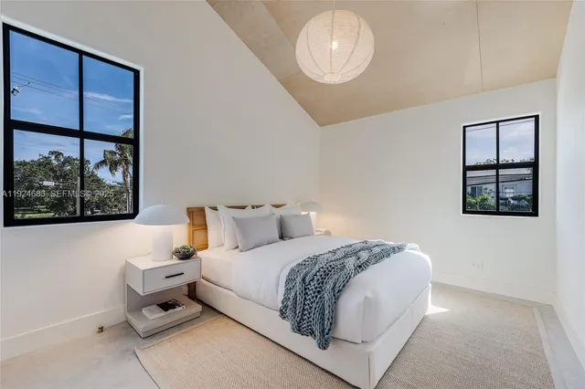 a bathroom with a toilet and a mirror