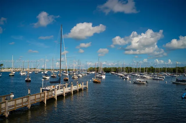 a living room with furniture and stairs