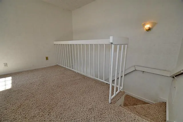 a view of a livingroom with furniture and a fireplace