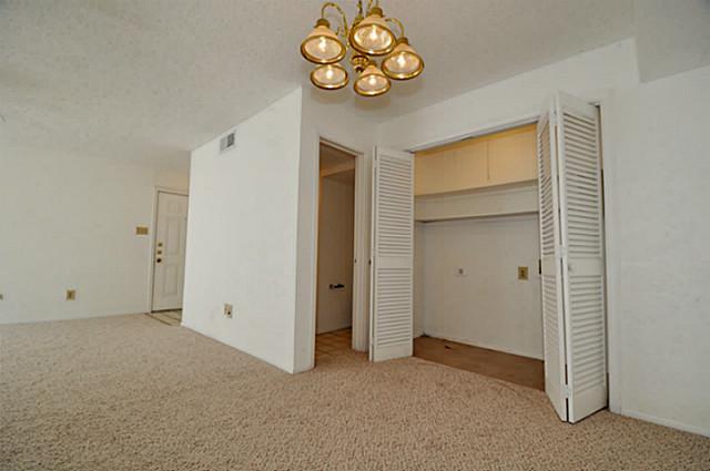 5630 Spring Valley Road, Unit 18C Dallas, TX 75254 - Photo 19 of 20 a view of an empty room with a window