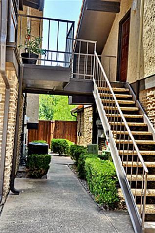 5630 Spring Valley Road, Unit 18C Dallas, TX 75254 - Photo 7 of 20 front view of a house with a small yard