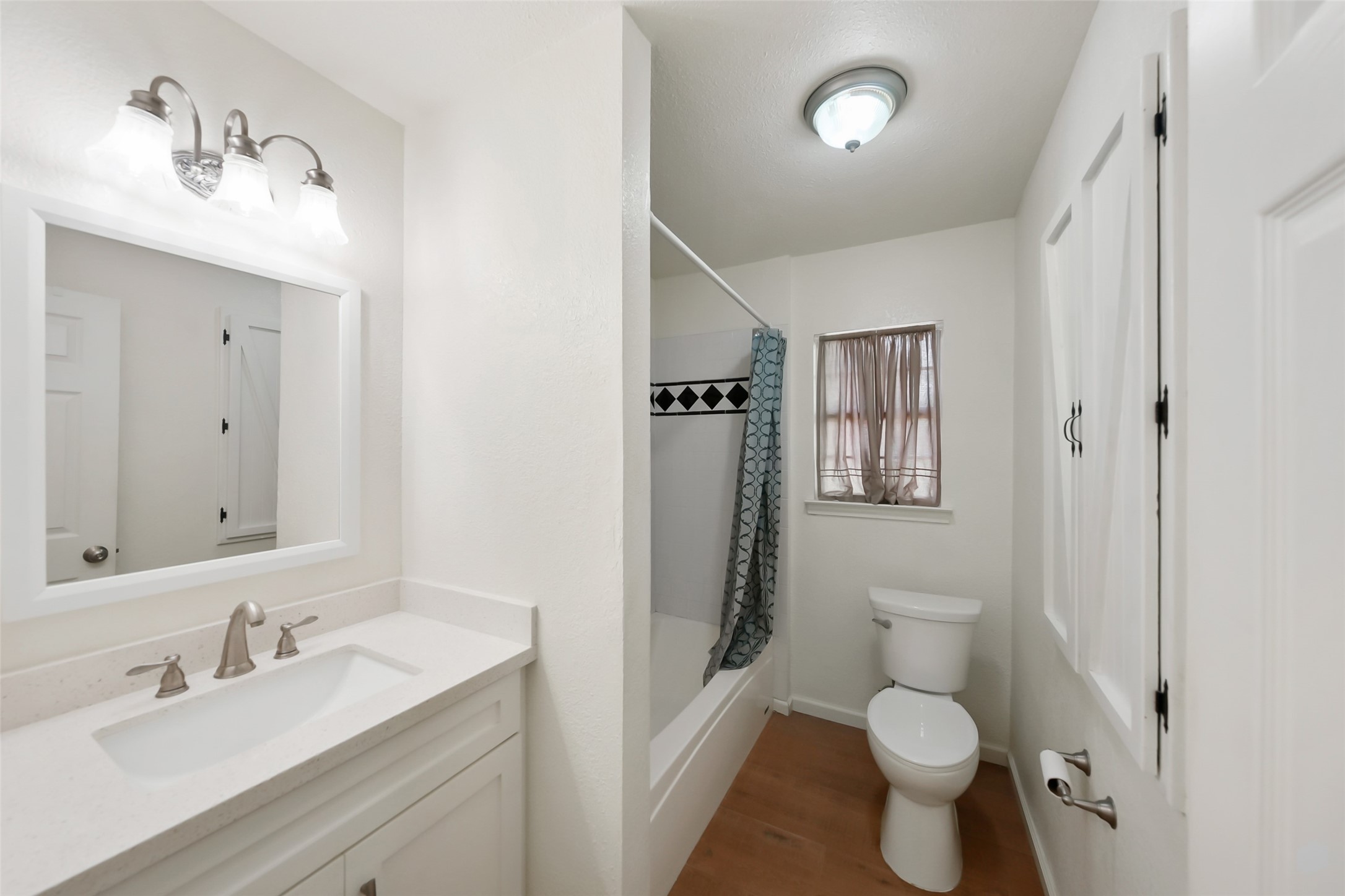 19635 Kermier Road Waller, TX 77484 - Photo 14 of 27 Full guest bathroom with a vanity and tub/shower combination.