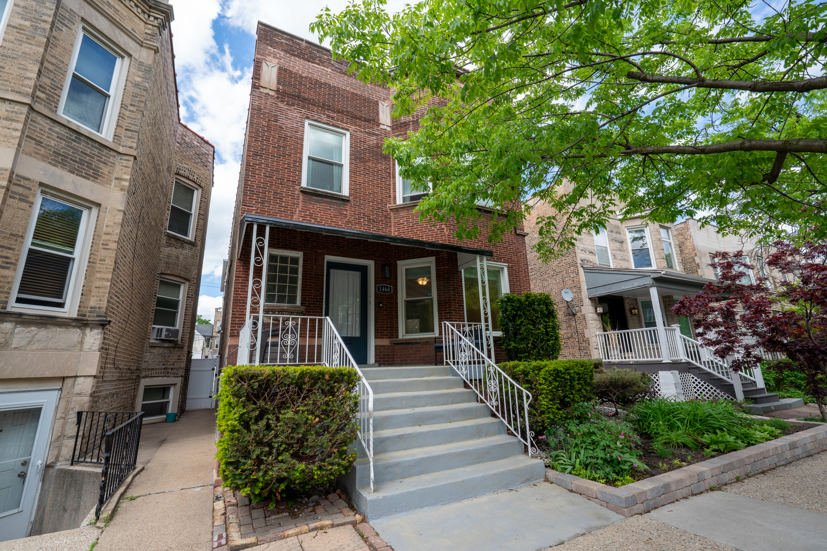 1460 West Foster Avenue, Unit 1 Chicago, IL 60640 - Photo 1 of 14 a front view of a house