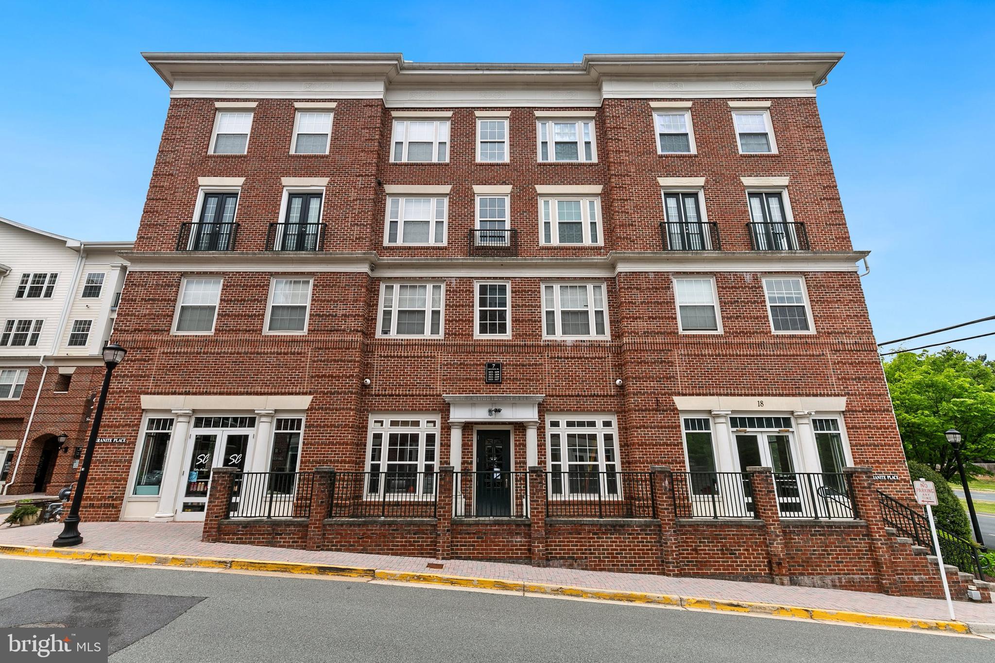 7 Granite Place, Unit 316 Gaithersburg, MD 20878 - Photo 1 of 84 a front view of a building with windows