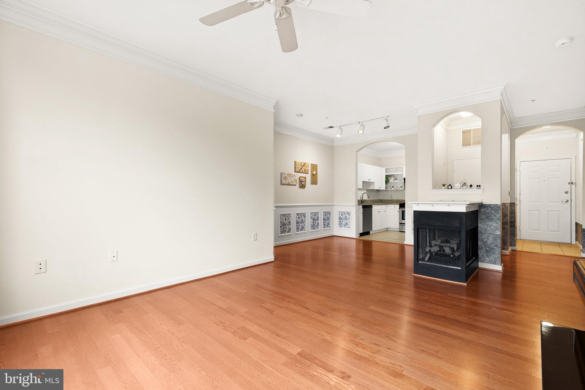 7 Granite Place, Unit 316 Gaithersburg, MD 20878 - Photo 11 of 84 a view of kitchen and hall with wooden floor