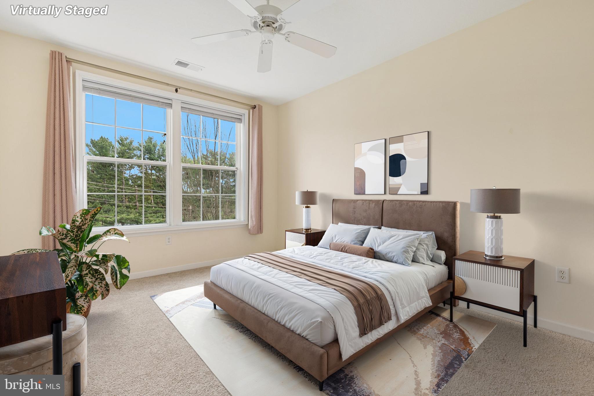 7 Granite Place, Unit 316 Gaithersburg, MD 20878 - Photo 17 of 84 a bedroom with a large bed and a potted plant