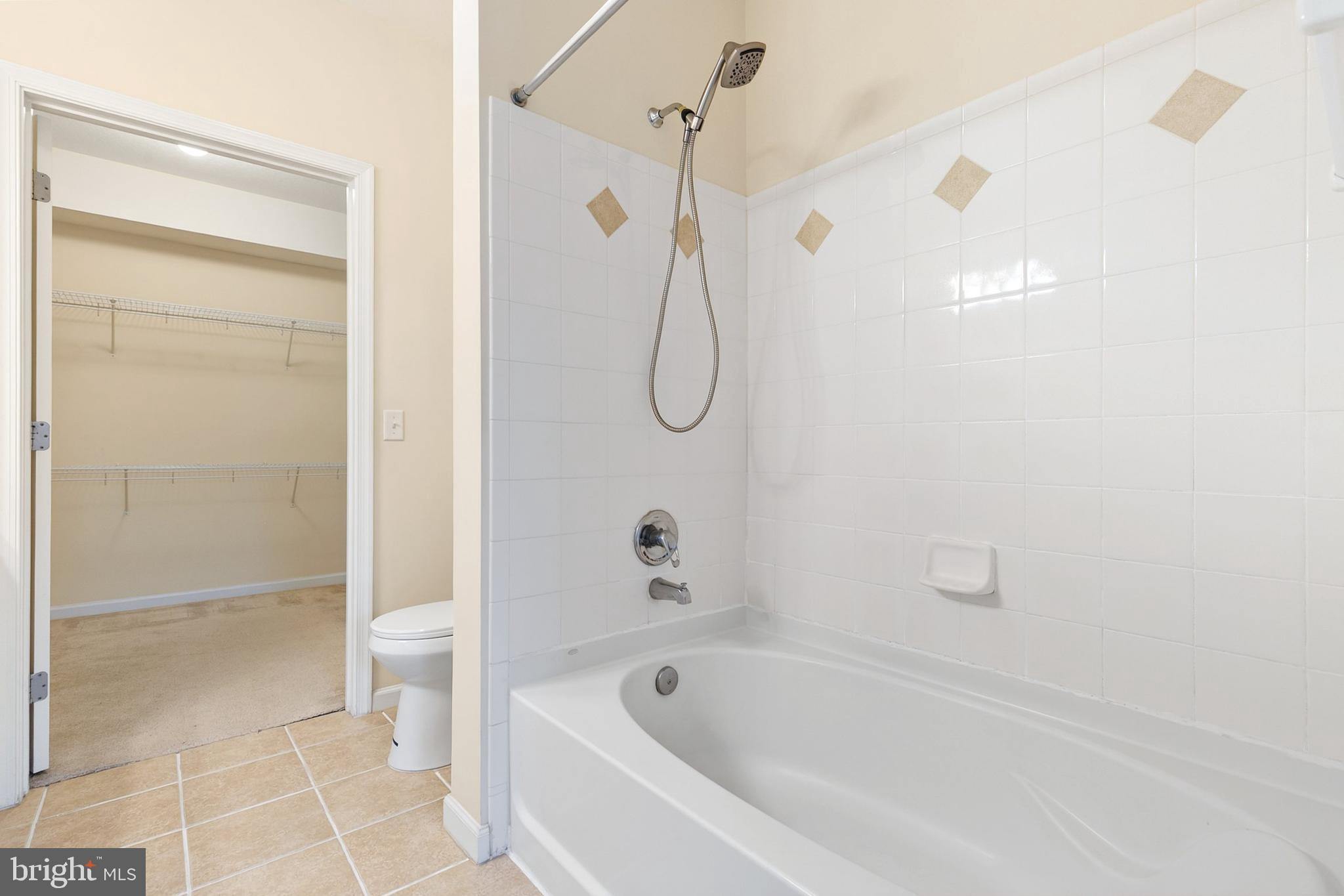 7 Granite Place, Unit 316 Gaithersburg, MD 20878 - Photo 20 of 84 a bathroom with a bathtub and shower