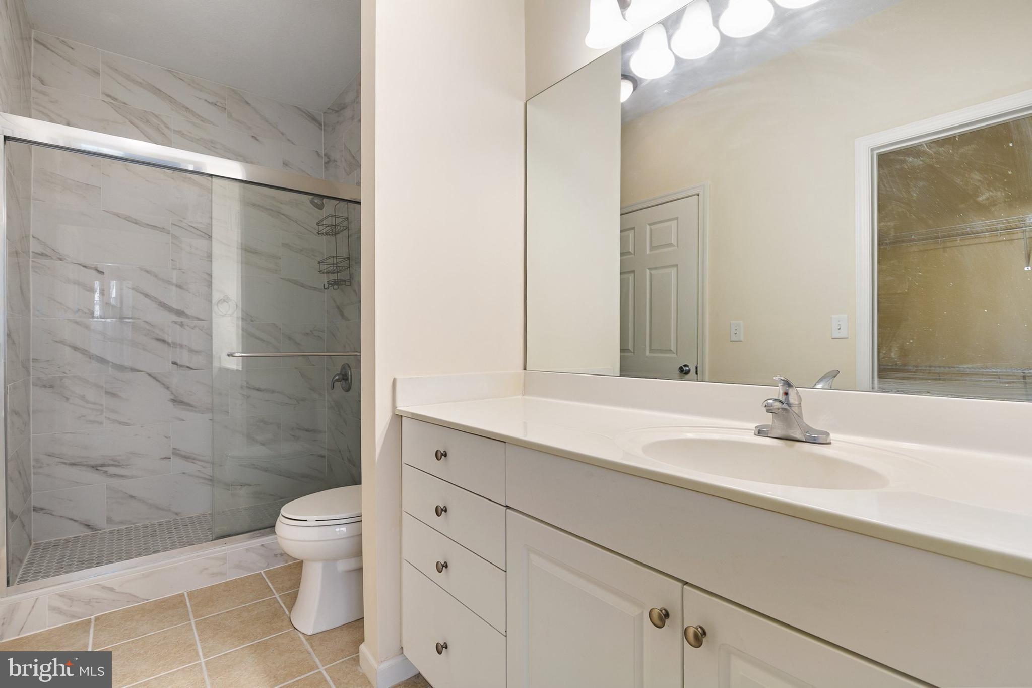 7 Granite Place, Unit 316 Gaithersburg, MD 20878 - Photo 25 of 84 a bathroom with a sink toilet and shower