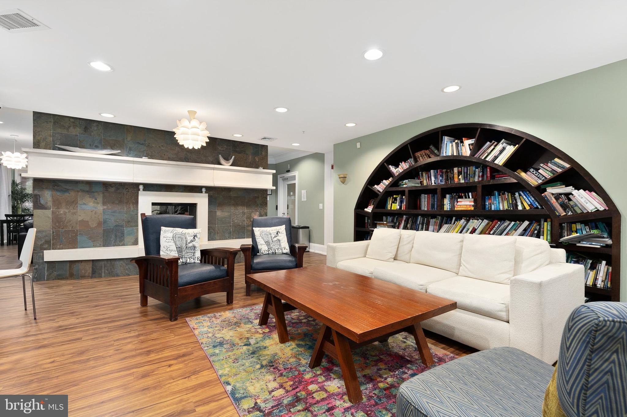 7 Granite Place, Unit 316 Gaithersburg, MD 20878 - Photo 44 of 84 a living room with furniture and a fireplace