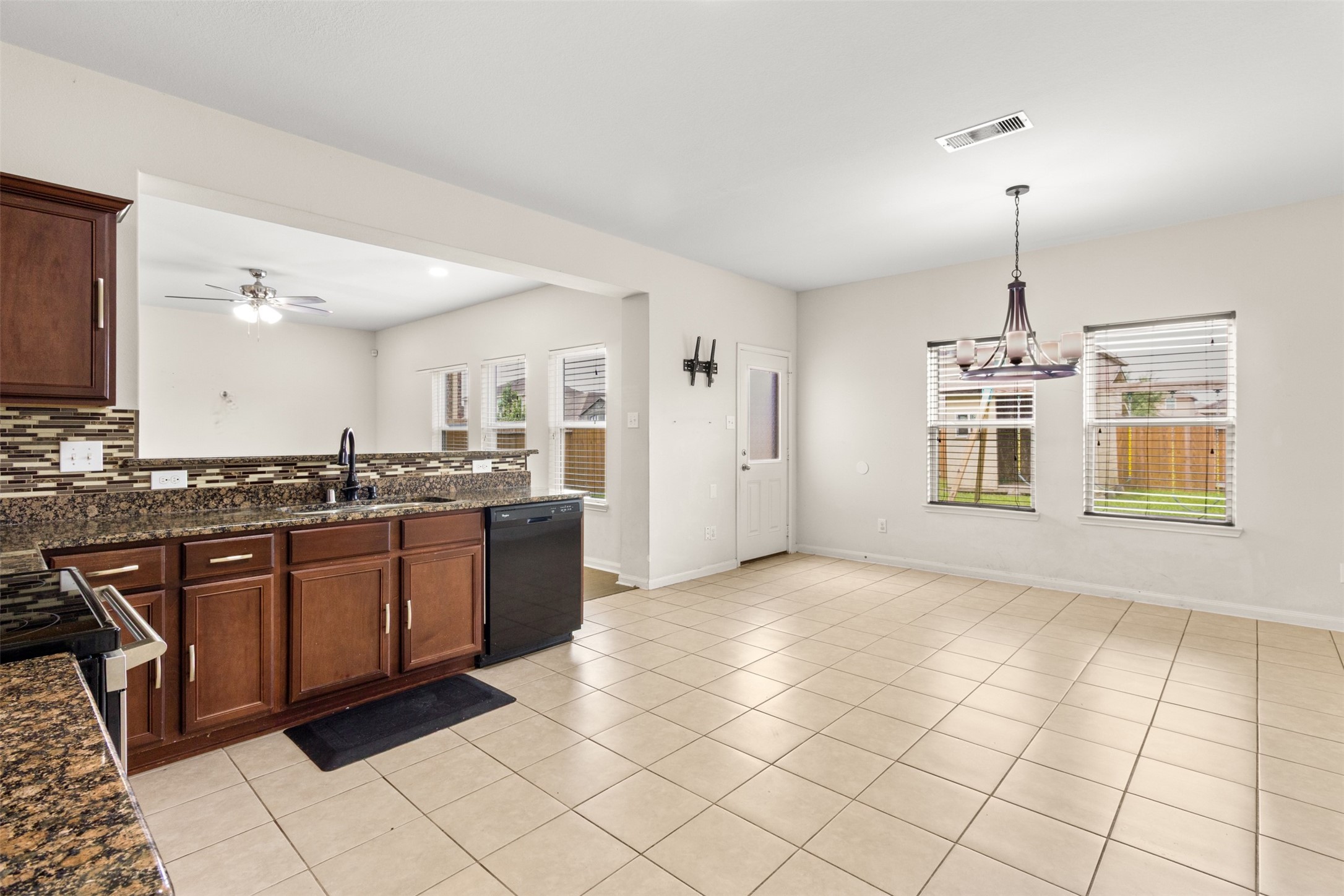 9426 Grand Spark Drive Rosharon, TX 77583 - Photo 8 of 31 The open design allows the chef to remain part of the conversation while preparing meals. Whether cooking for two or hosting a crowd, this kitchen is ready for every occasion.