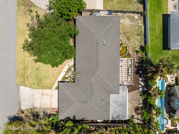 an aerial view of residential houses with outdoor space