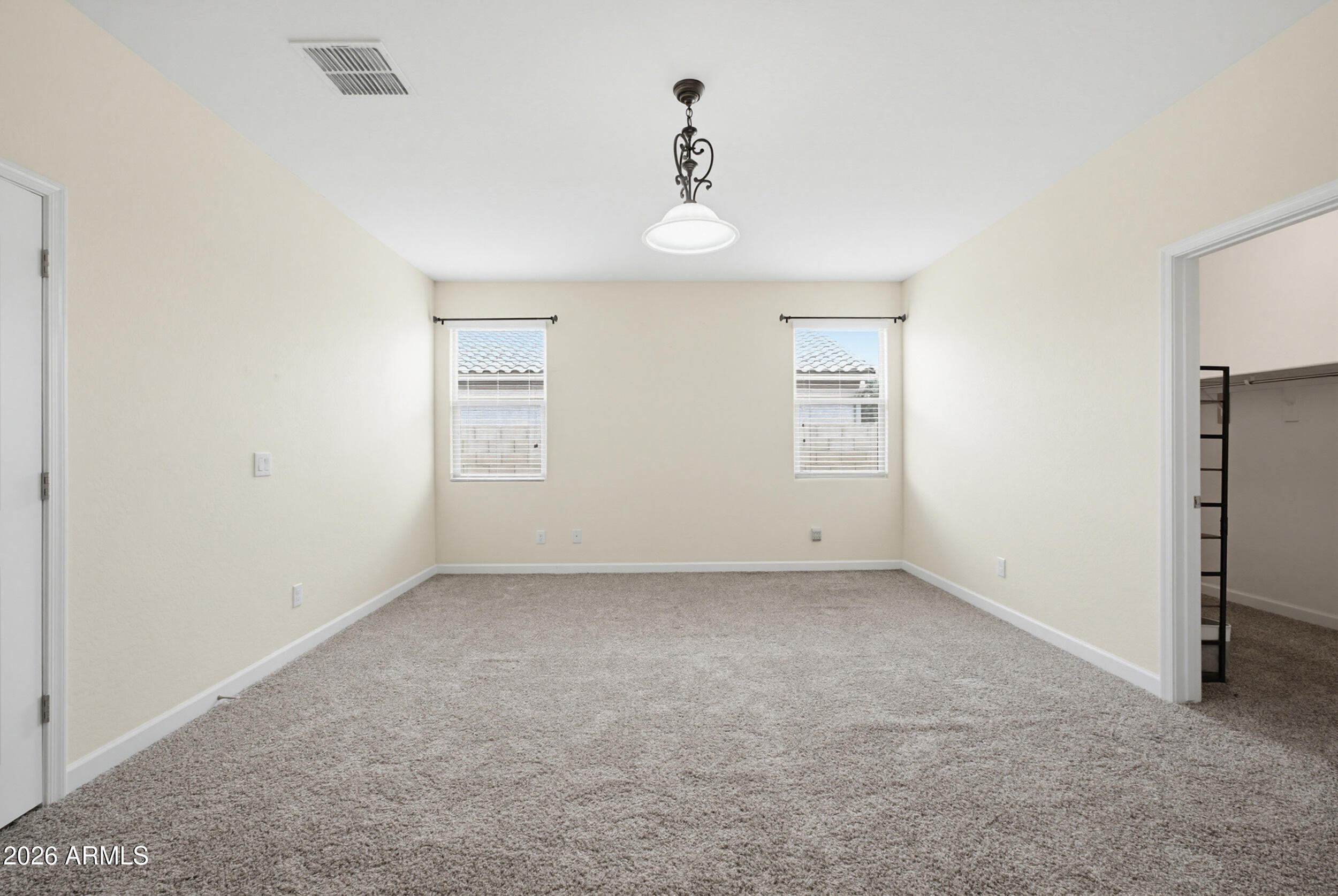 19995 North Ben Court Maricopa, AZ 85138 - Photo 24 of 51 a view of an empty room with a window