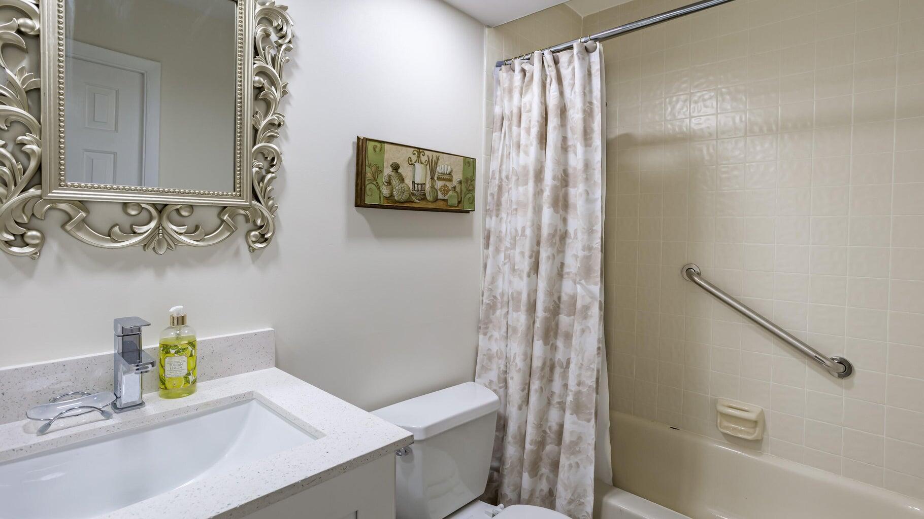 7460 La Paz Boulevard, Unit 208 Boca Raton, FL 33433 - Photo 19 of 23 a bathroom with a sink and a shower