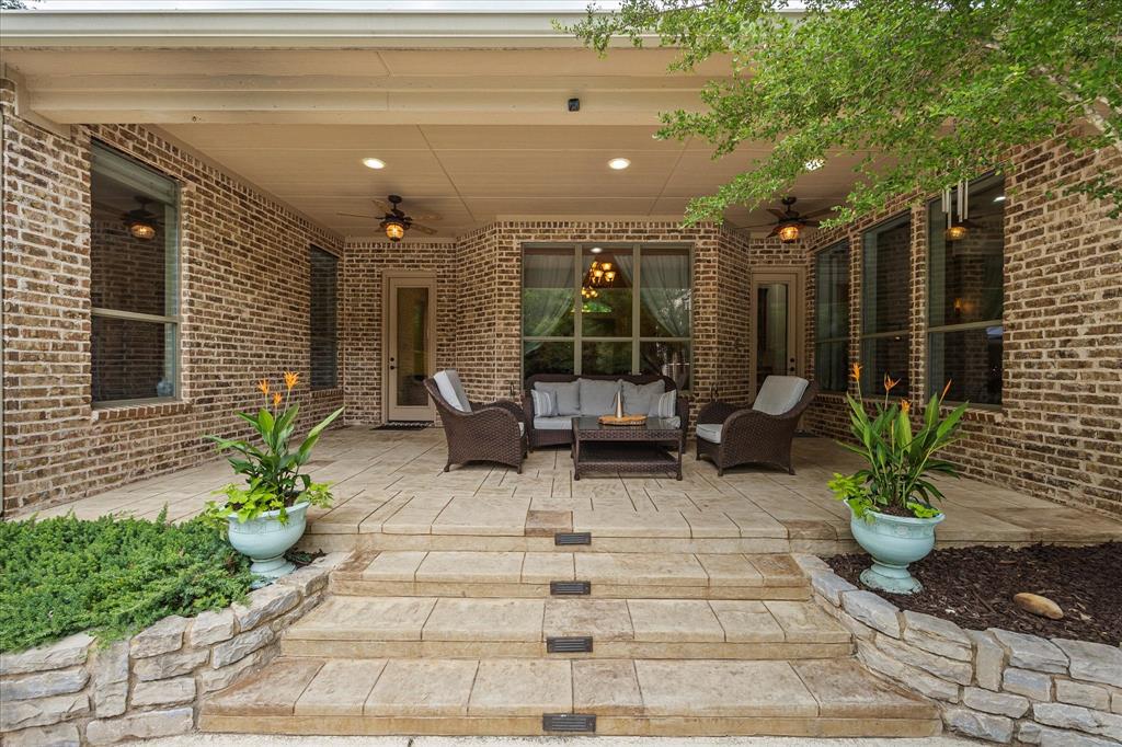 1704 White Road Heath, TX 75032 - Photo 11 of 28 a view of a patio with chairs and potted plants