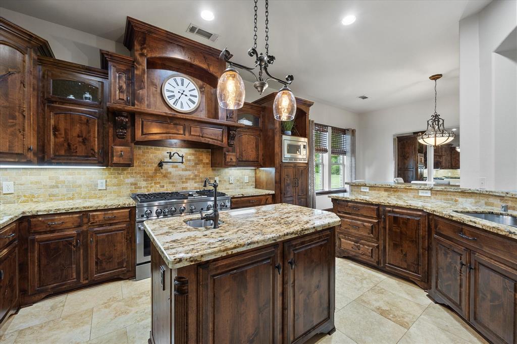 1704 White Road Heath, TX 75032 - Photo 14 of 28 a kitchen with a stove and a clock