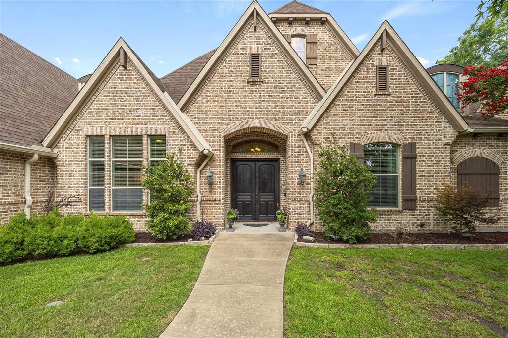 1704 White Road Heath, TX 75032 - Photo 2 of 28 a front view of a house with garden