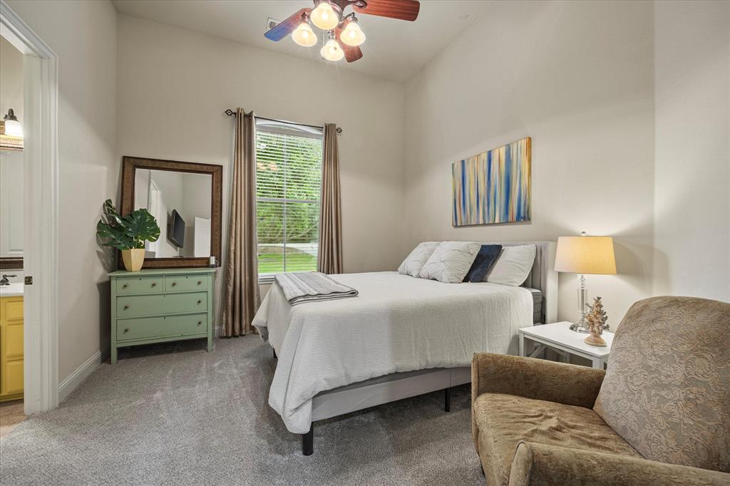 1704 White Road Heath, TX 75032 - Photo 22 of 28 a bedroom with a bed and a dresser