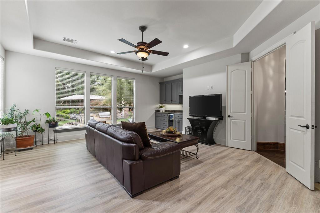 1704 White Road Heath, TX 75032 - Photo 26 of 28 a living room with furniture and a flat screen tv