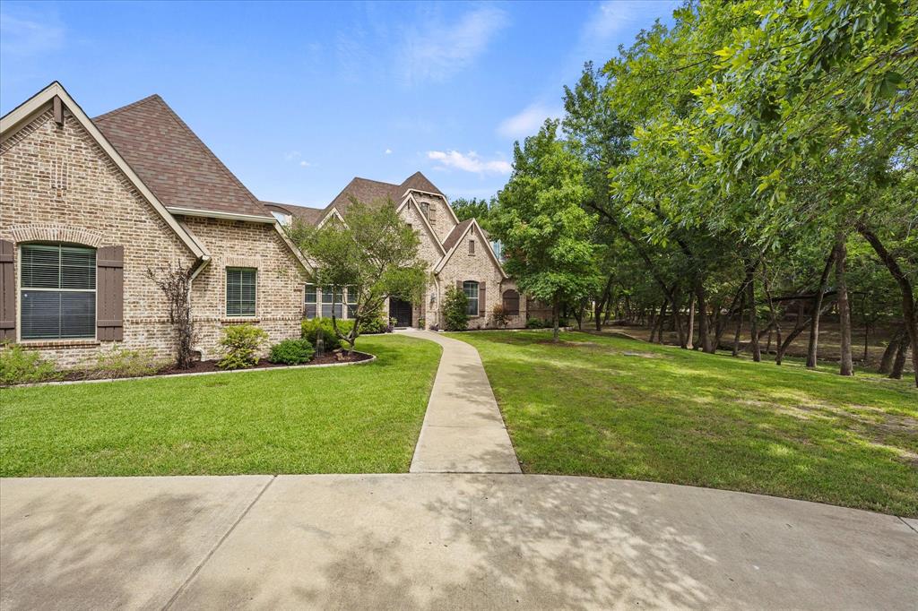 1704 White Road Heath, TX 75032 - Photo 28 of 28 a view of a house with a yard