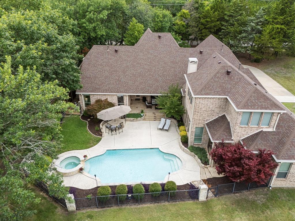1704 White Road Heath, TX 75032 - Photo 3 of 28 an aerial view of a house with swimming pool and outdoor space