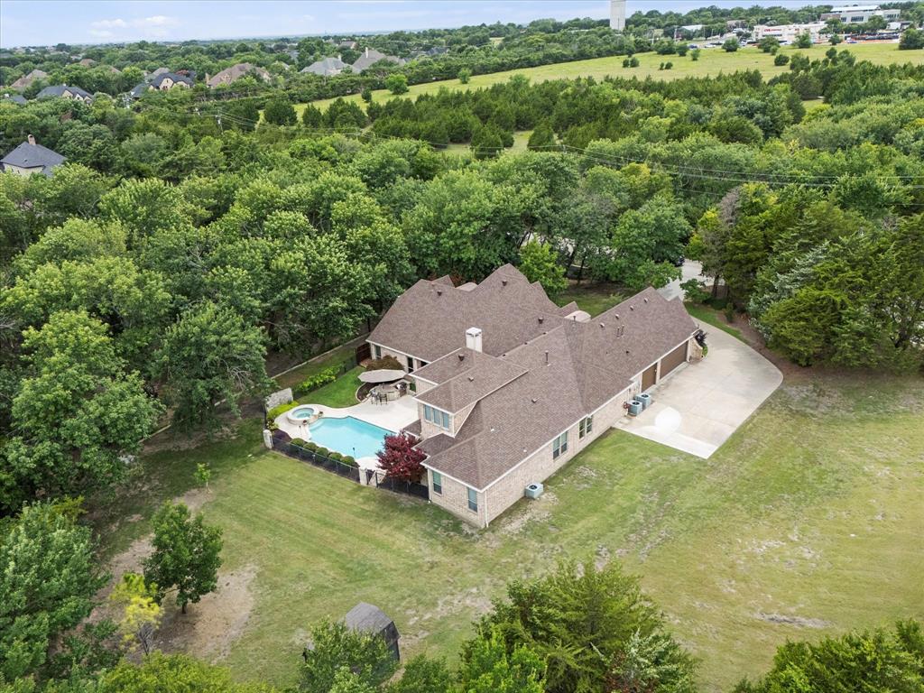1704 White Road Heath, TX 75032 - Photo 4 of 28 an aerial view of a house with a yard