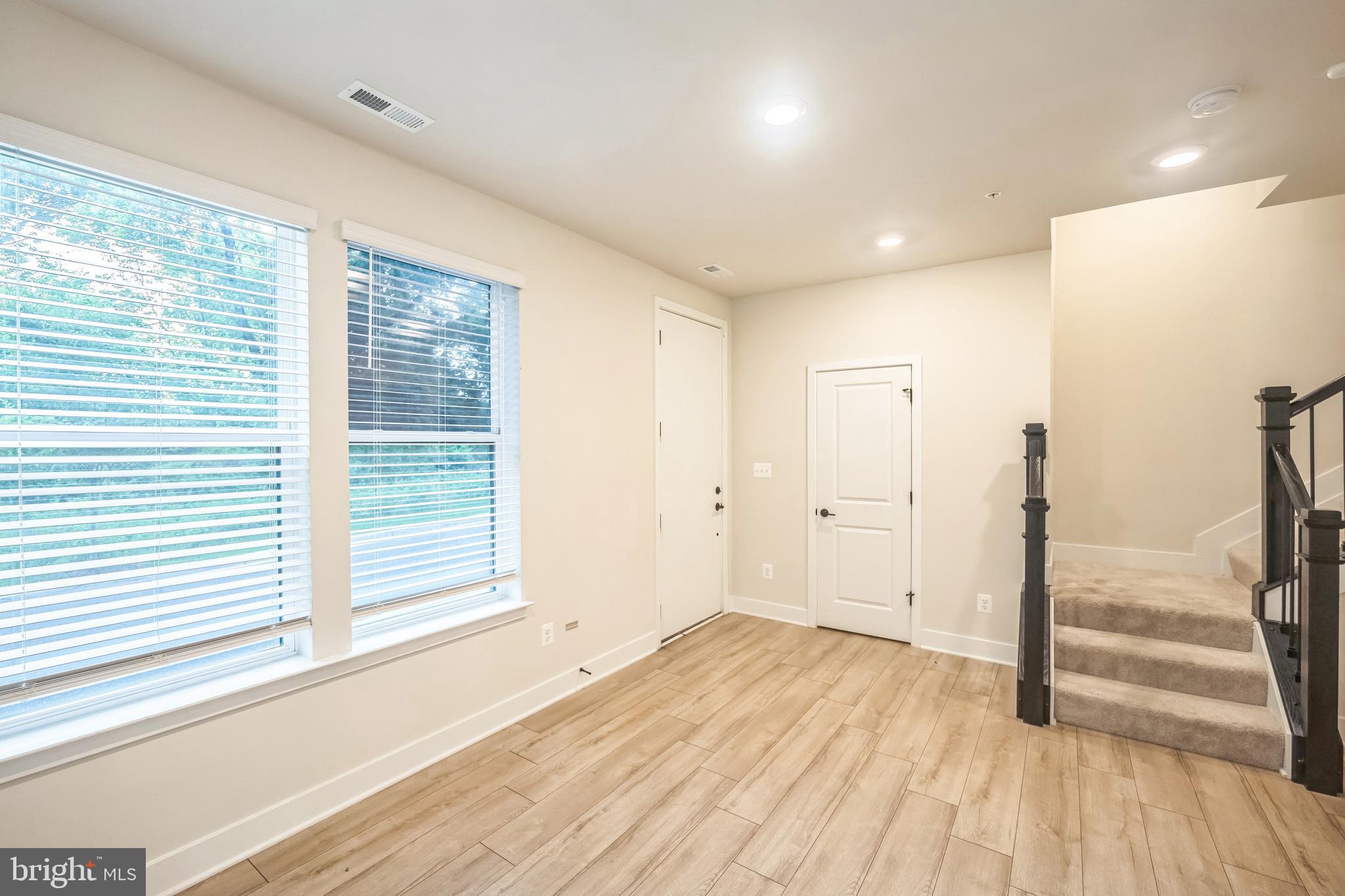 4402 Roland Heights Avenue Baltimore, MD 21211 - Photo 3 of 47 a view of a room with wooden floor and window