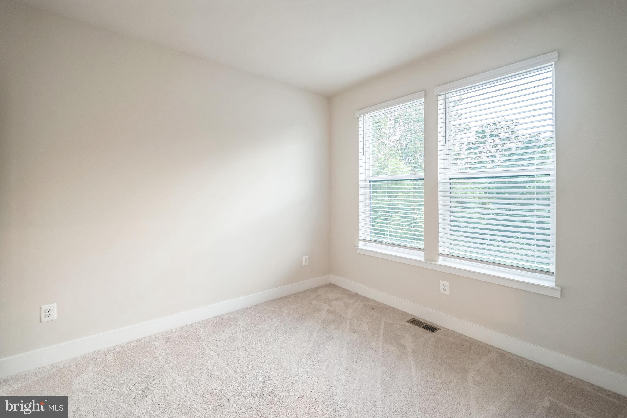 4402 Roland Heights Avenue Baltimore, MD 21211 - Photo 31 of 47 a view of an empty room with a window