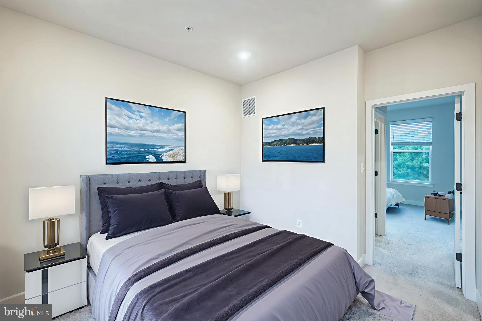 4402 Roland Heights Avenue Baltimore, MD 21211 - Photo 34 of 47 a bedroom with a bed and a painting on the wall