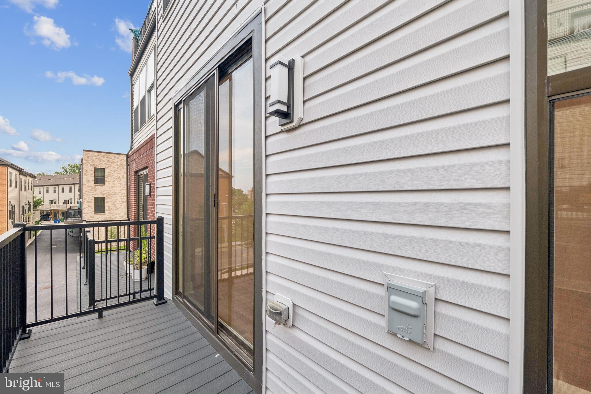 4402 Roland Heights Avenue Baltimore, MD 21211 - Photo 42 of 47 a view of a balcony with wooden floor