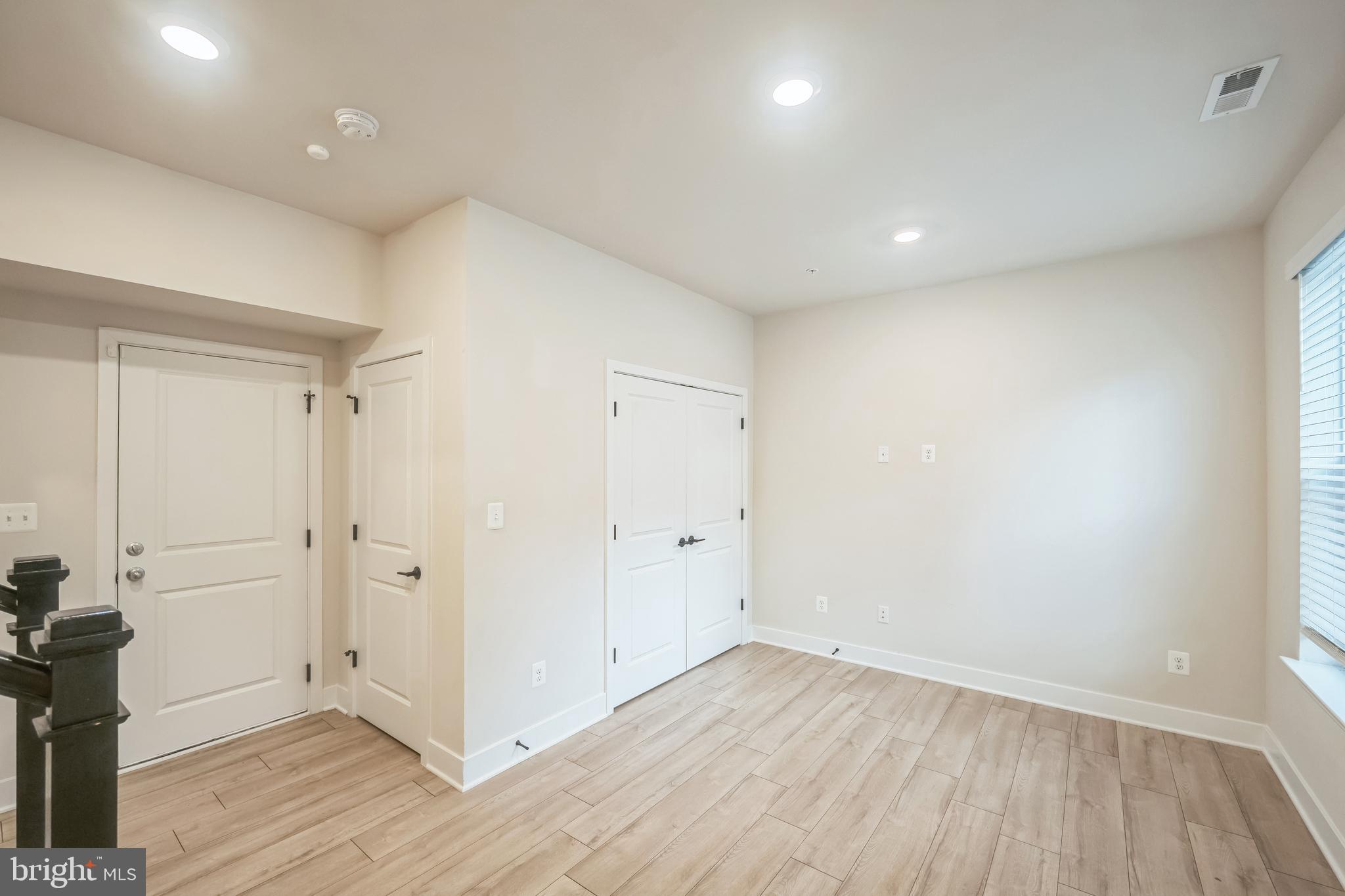 4402 Roland Heights Avenue Baltimore, MD 21211 - Photo 6 of 47 a view of an empty room with wooden floor