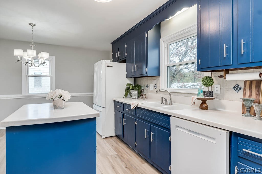 8117 Valencia Road Chesterfield, VA 23832 - Photo 11 of 30 a kitchen with a sink cabinets a window and stainless steel appliances