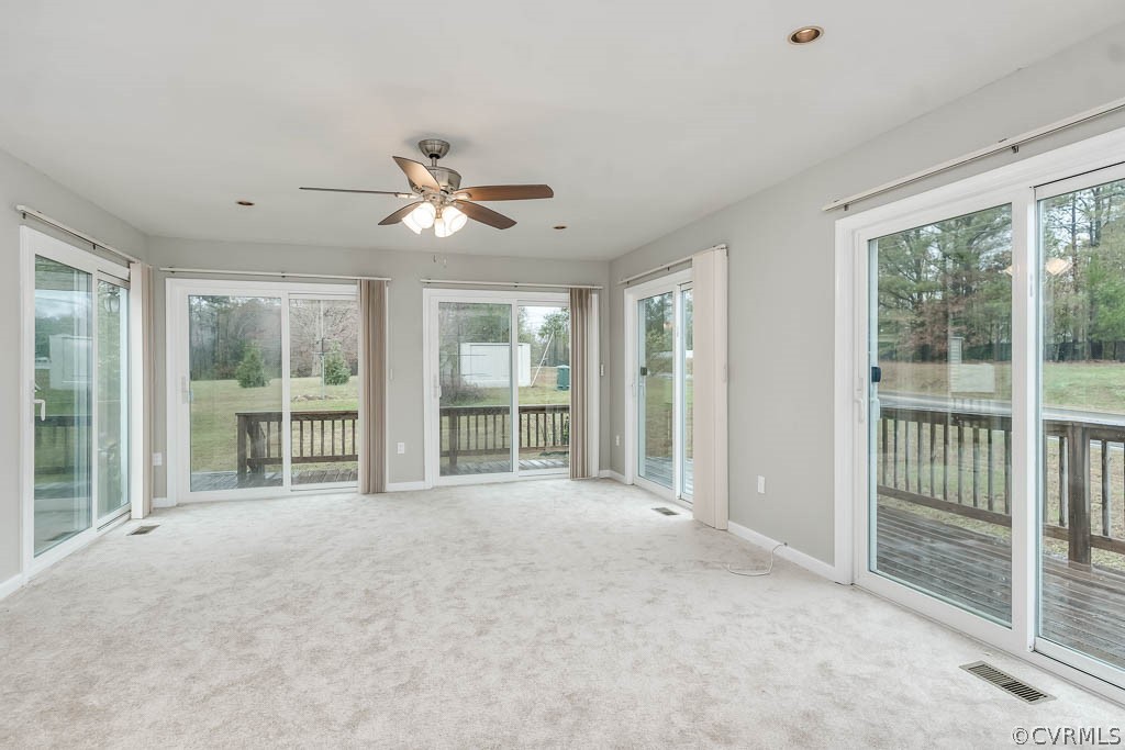 8117 Valencia Road Chesterfield, VA 23832 - Photo 15 of 30 a view of a livingroom with a ceiling fan and windows