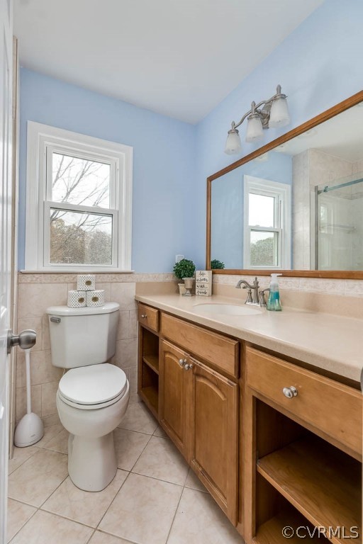 8117 Valencia Road Chesterfield, VA 23832 - Photo 20 of 30 a spacious bathroom with a toilet sink and mirror
