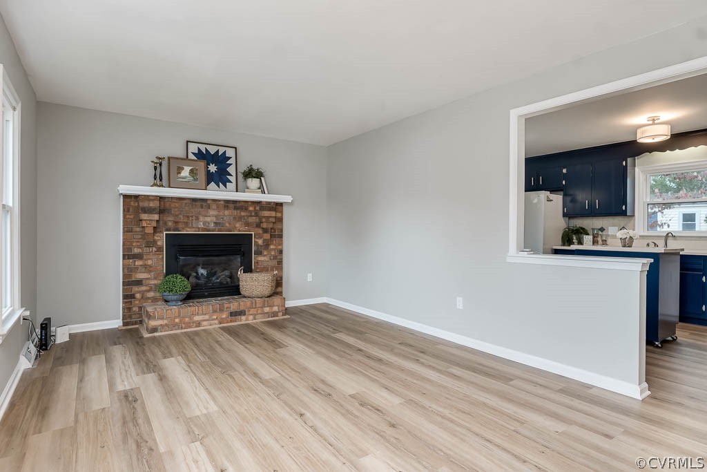 8117 Valencia Road Chesterfield, VA 23832 - Photo 5 of 30 a view of an empty room with a fireplace and a window
