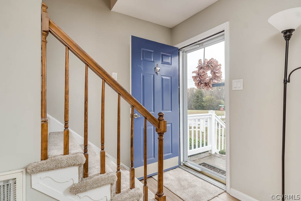 8117 Valencia Road Chesterfield, VA 23832 - Photo 7 of 30 a view of an entryway with wooden floor and door