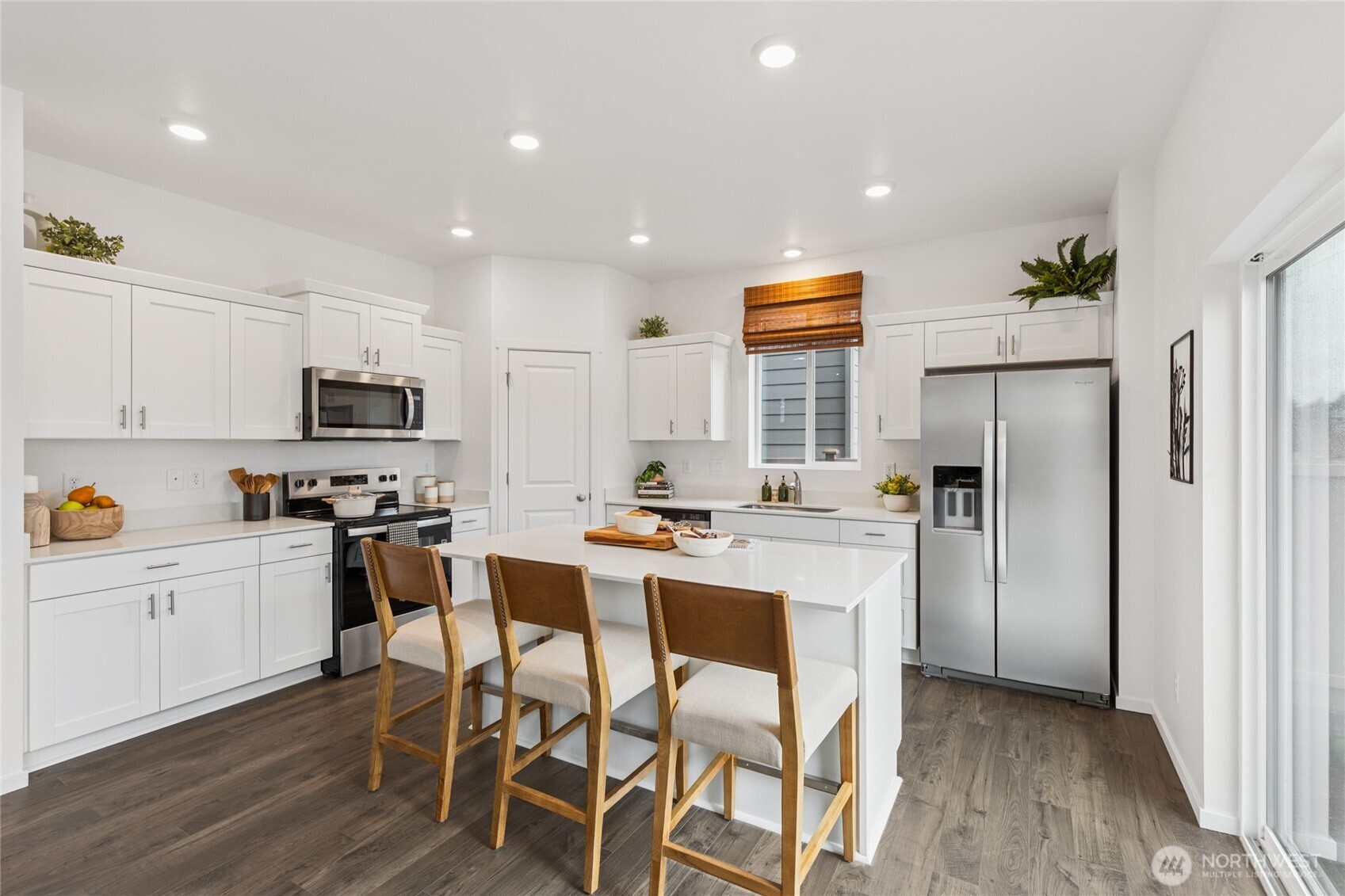 563 Hann Street, Unit 9 Buckley, WA 98321 - Photo 4 of 37 a kitchen with stainless steel appliances granite countertop a refrigerator and a stove top oven