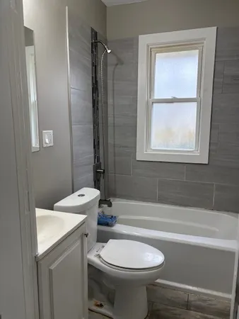 a bathroom with a sink a toilet and a bathtub