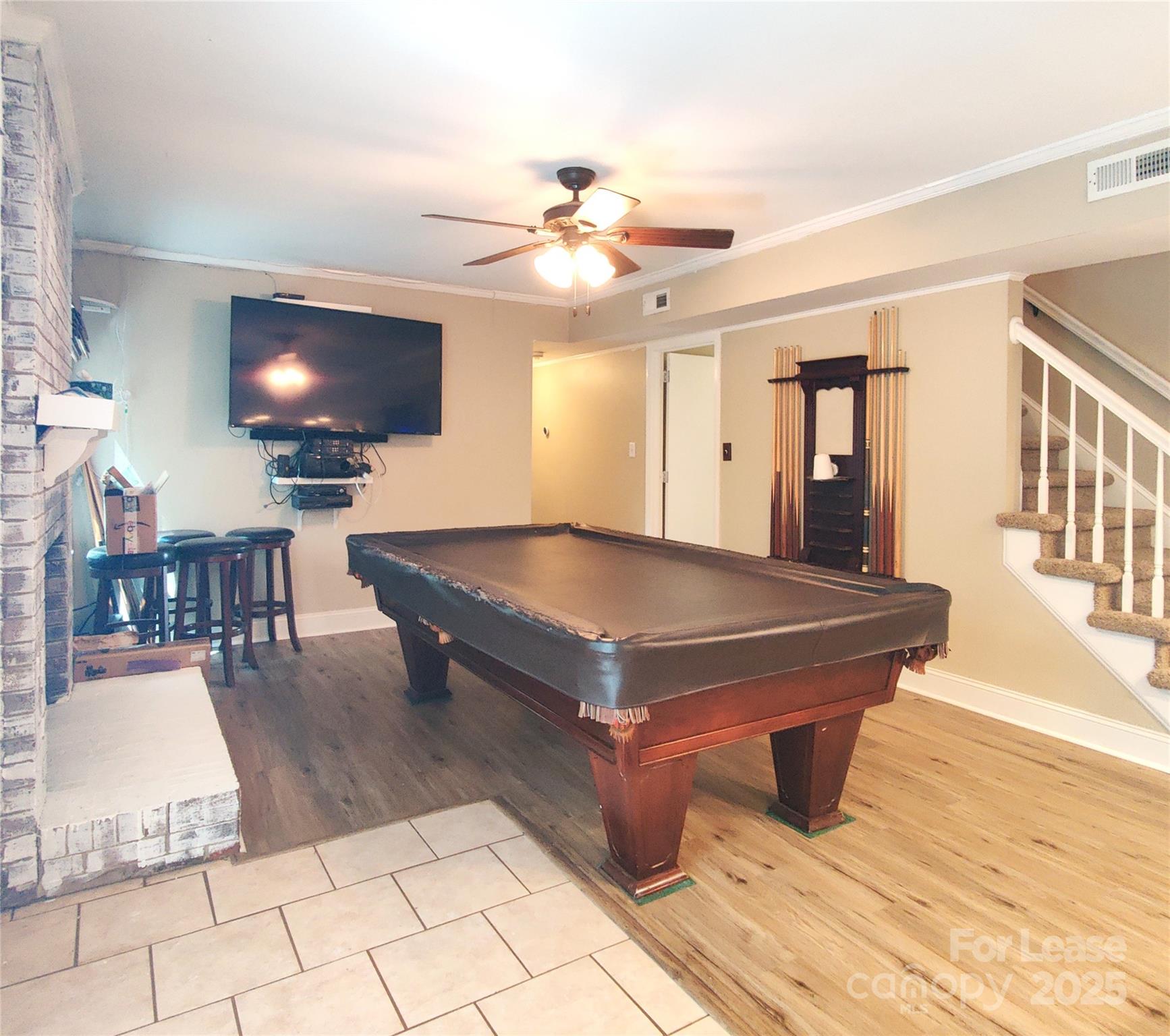 8644 Kirchenbaum Drive Charlotte, NC 28210 - Photo 11 of 28 a living room with pool table and a flat screen tv