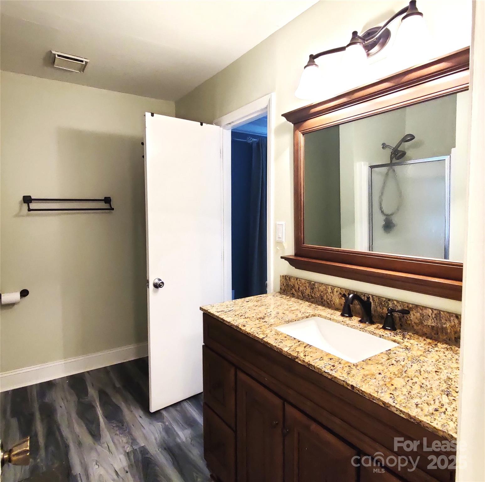 8644 Kirchenbaum Drive Charlotte, NC 28210 - Photo 13 of 28 a bathroom with a granite countertop sink and a mirror