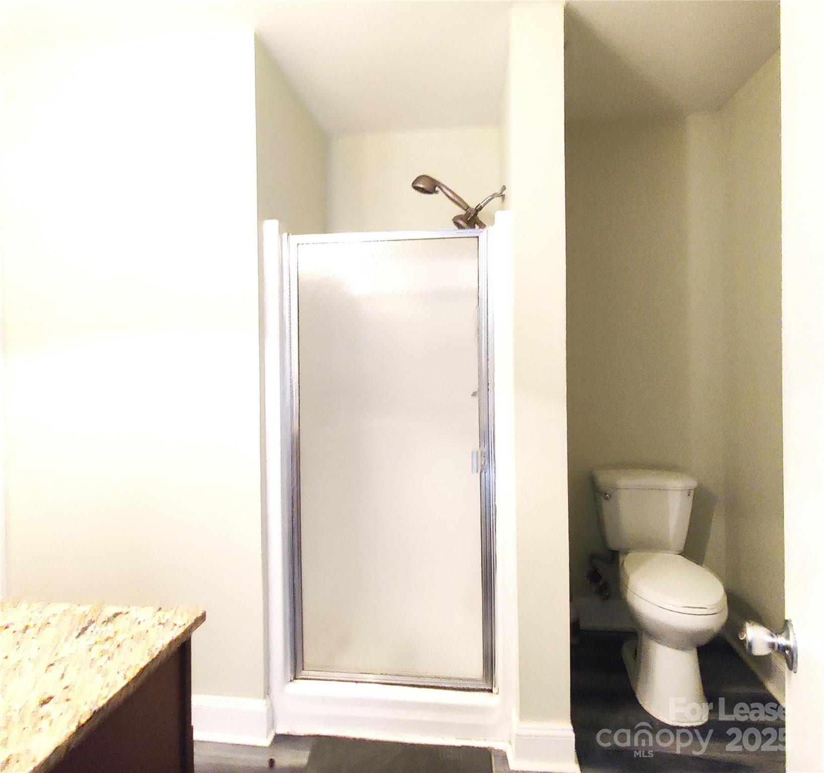 8644 Kirchenbaum Drive Charlotte, NC 28210 - Photo 14 of 28 a bathroom with a toilet and a sink