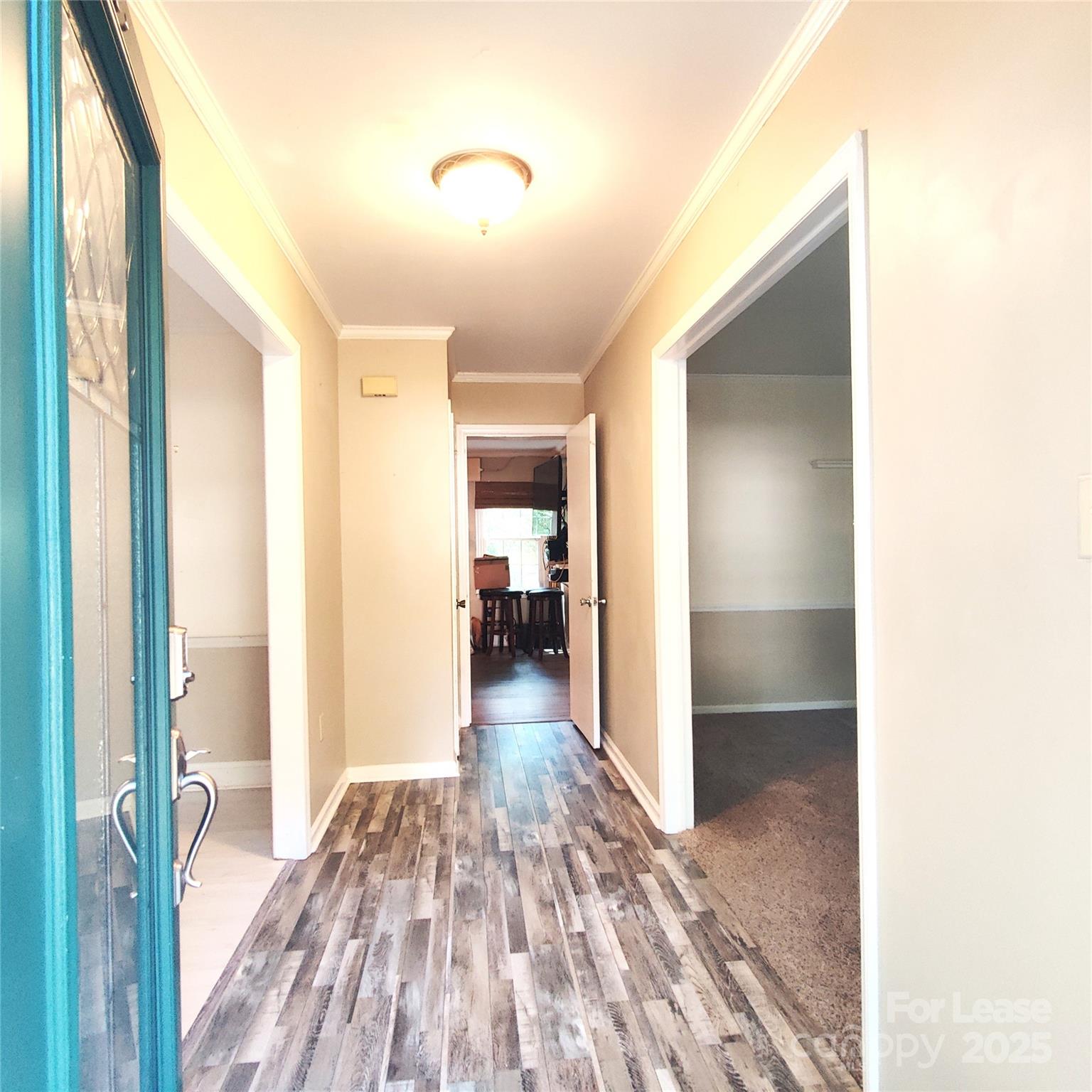 8644 Kirchenbaum Drive Charlotte, NC 28210 - Photo 2 of 28 a view of a hallway view with wooden floor and a bathroom