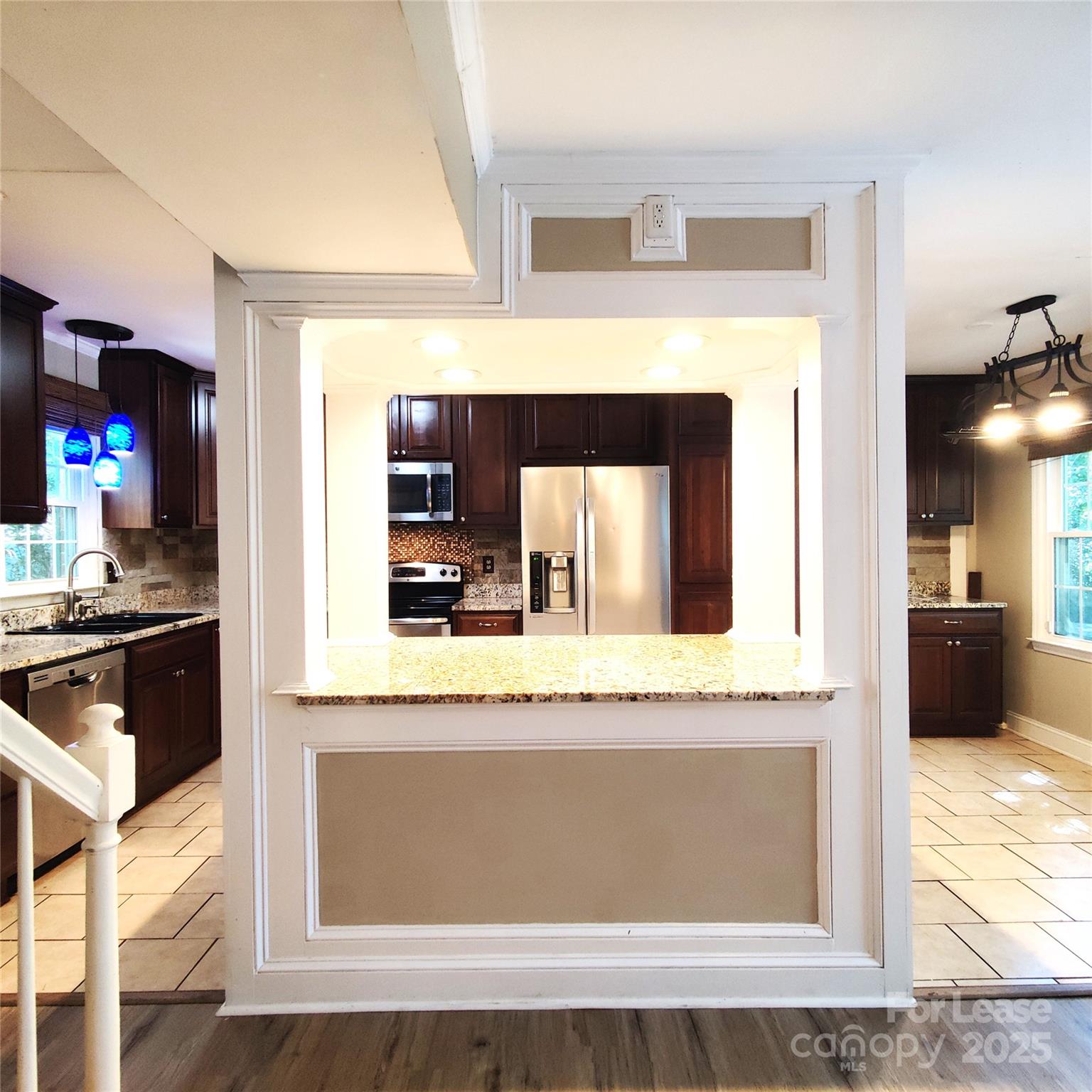 8644 Kirchenbaum Drive Charlotte, NC 28210 - Photo 6 of 28 a kitchen with granite countertop a sink and a stove top oven