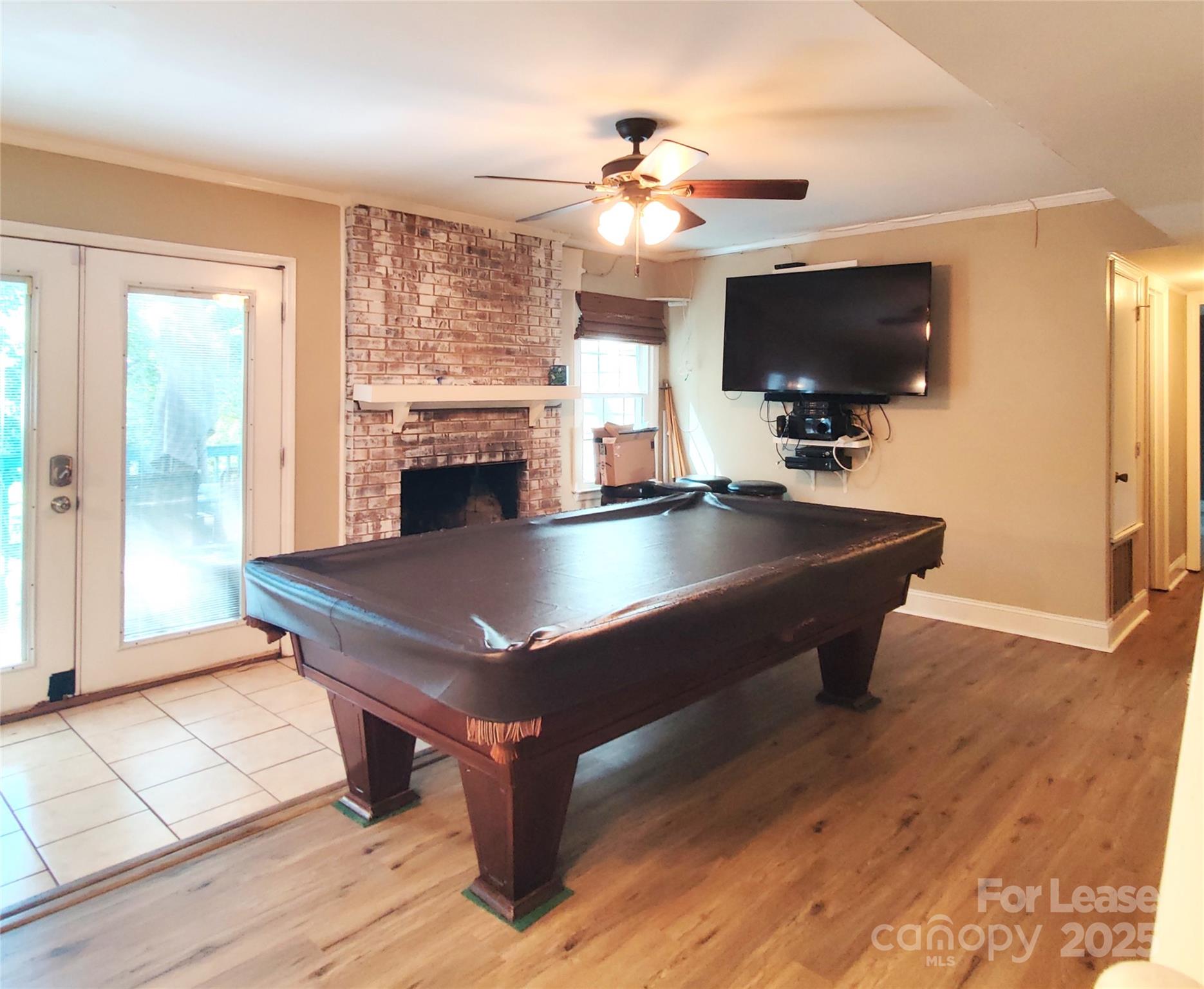 8644 Kirchenbaum Drive Charlotte, NC 28210 - Photo 10 of 28 a living room with furniture a flat screen tv and kitchen view