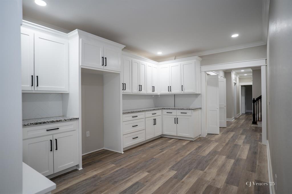 642 Circle M Drive Grand Cane, LA 71032 - Photo 22 of 40 a kitchen with white cabinets and stainless steel appliances