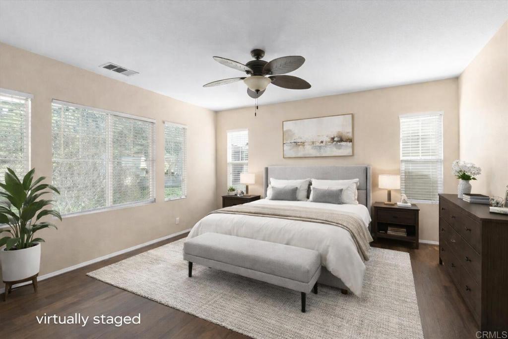 4163 Lake Cir Drive Fallbrook, CA 92028 - Photo 20 of 34 a bedroom with a large bed and a potted plant