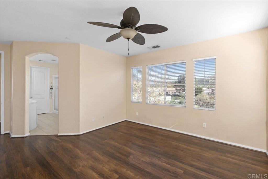 4163 Lake Cir Drive Fallbrook, CA 92028 - Photo 23 of 34 a view of an empty room with wooden floor and a window